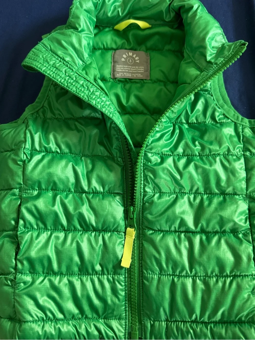 Primary Green Quilted Sleeveless Puffer Vest with Yellow Zip Pull